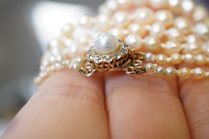 A natural pearl and diamond necklace, early 20th century
